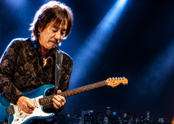 Masayoshi Takanaka playing guitar on stage during his 2026 world tour concert