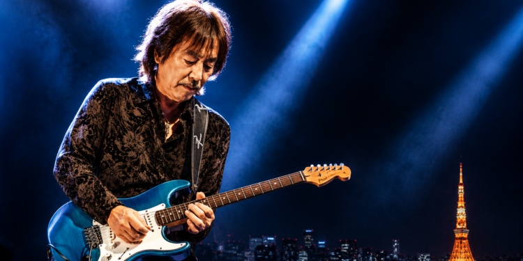 Masayoshi Takanaka playing guitar on stage during his 2026 world tour concert