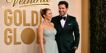 John Krasinski smiling at a Hollywood movie premiere